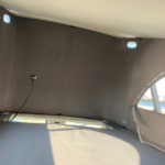 Inside the roof tent of a Campervan VW California Comfortline