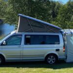 VW California campervan with roof tent and extra tent at rear